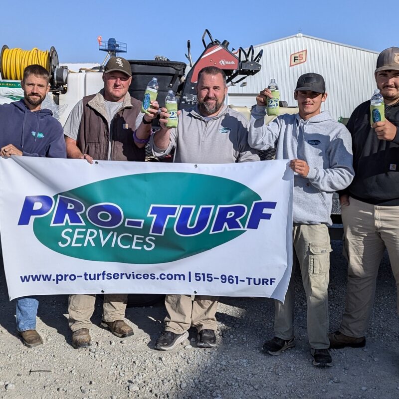 PRO-TURF Services team raising a toast to 25 years in business